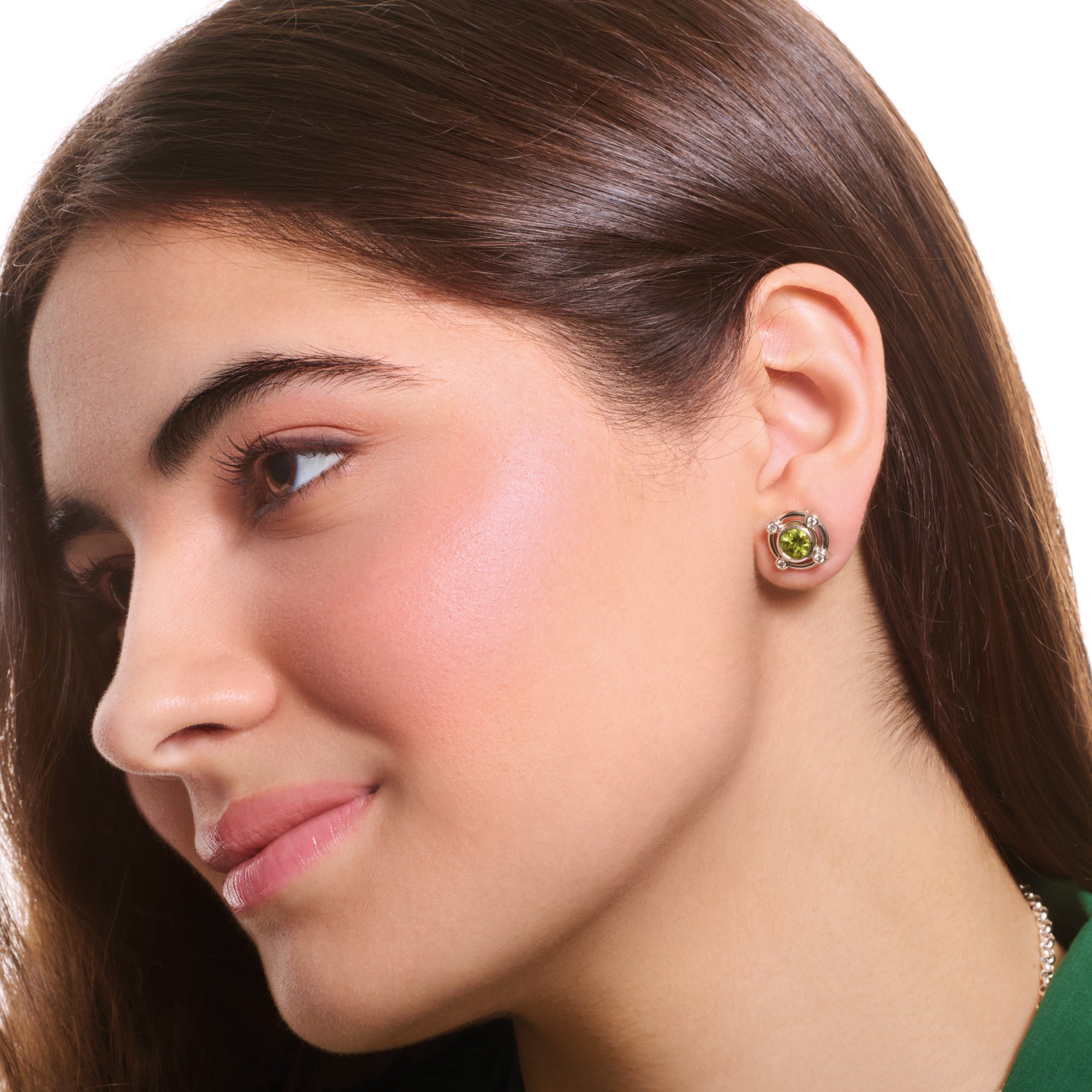 Model wearing a handcrafted white gold earring halos featuring small round diamonds.