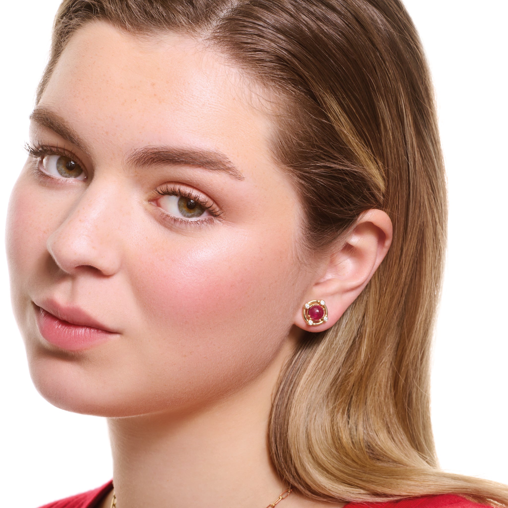 Model wearing handcrafted yellow gold earring halos featuring four smaller round diamonds.