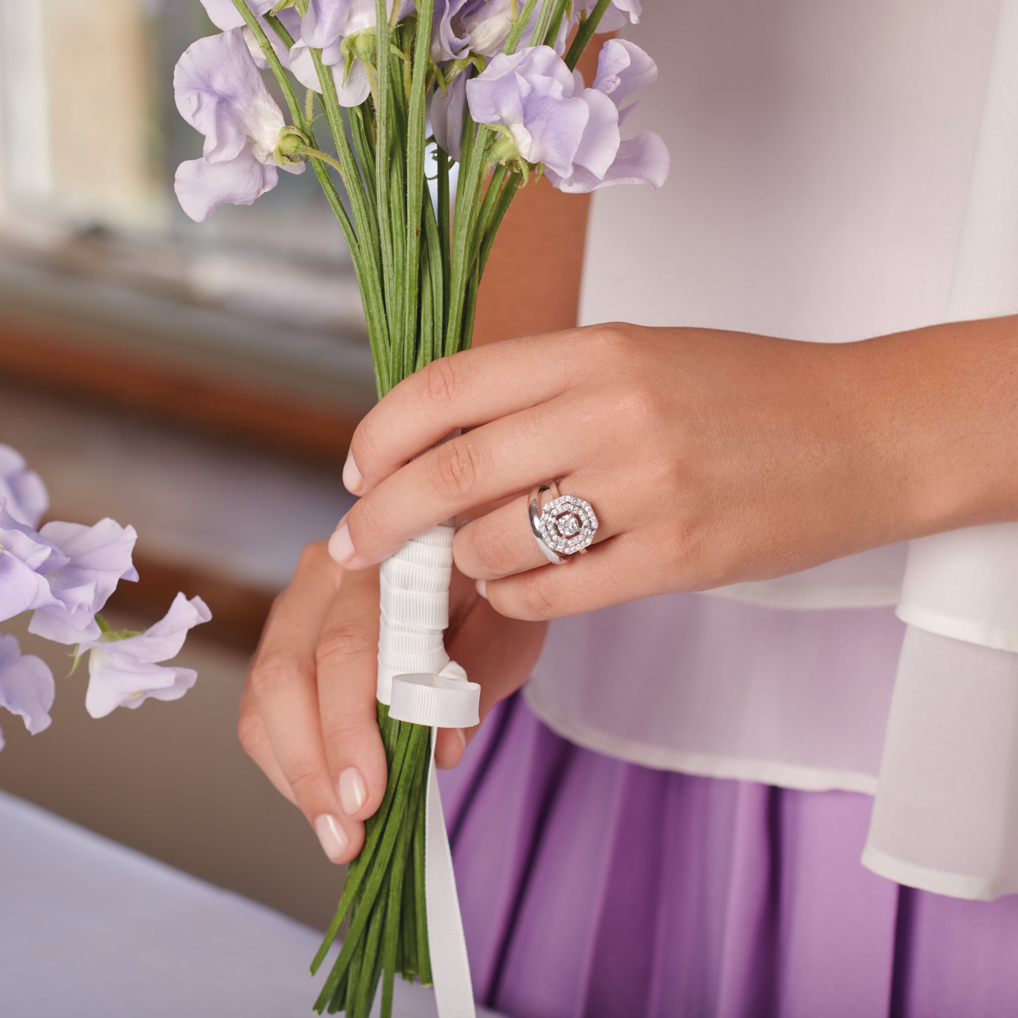 Model wearing a handcrafted 18ct white gold wedding band with a width of 3mm.