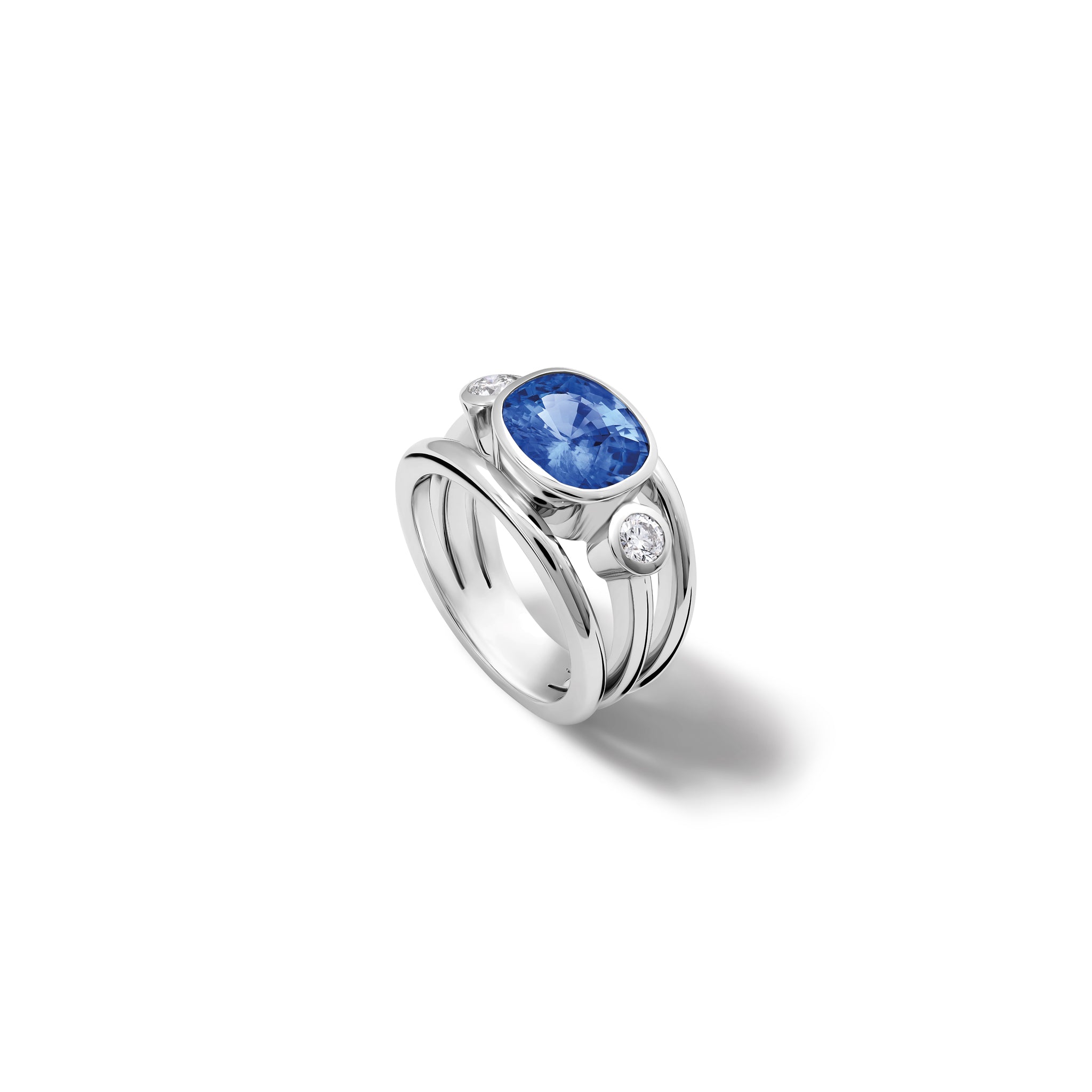 Handcrafted 18ct white gold ring with an oval sapphire, the birthstone of September, flanked by two round diamonds.