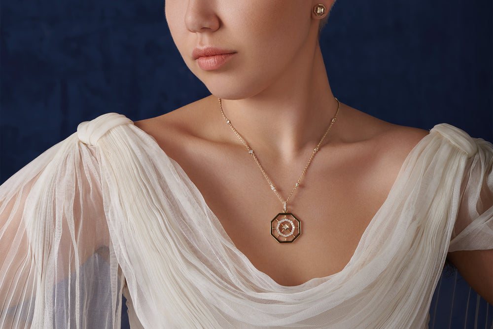 Model wearing handcrafted yellow gold jewellery featuring the Parquet octagonal design.