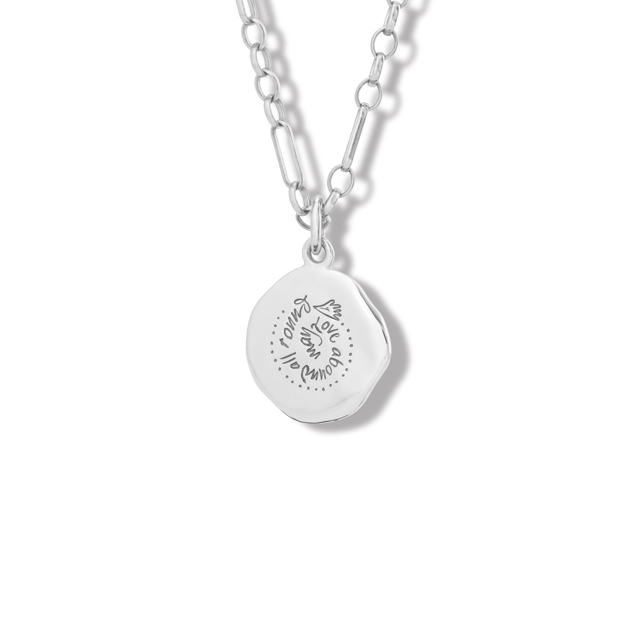 Handcrafted sterling silver necklace pendant engraved with the quote, 'May love abound all around.' 