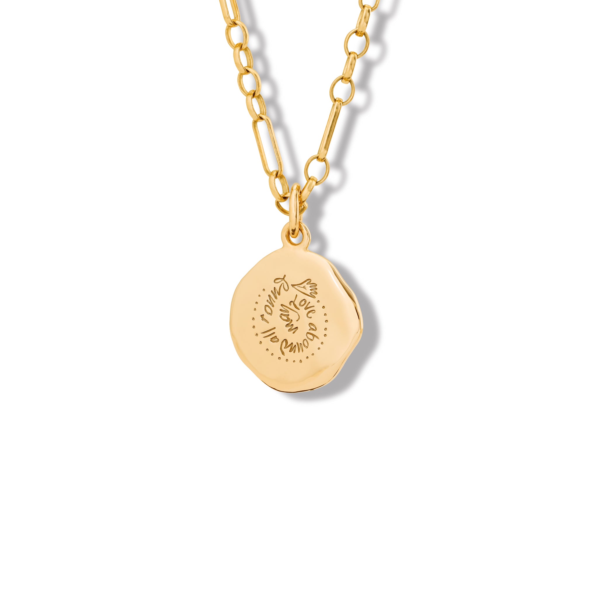 Handcrafted yellow gold necklace pendant engraved with the quote, 'May love abound all around.' 