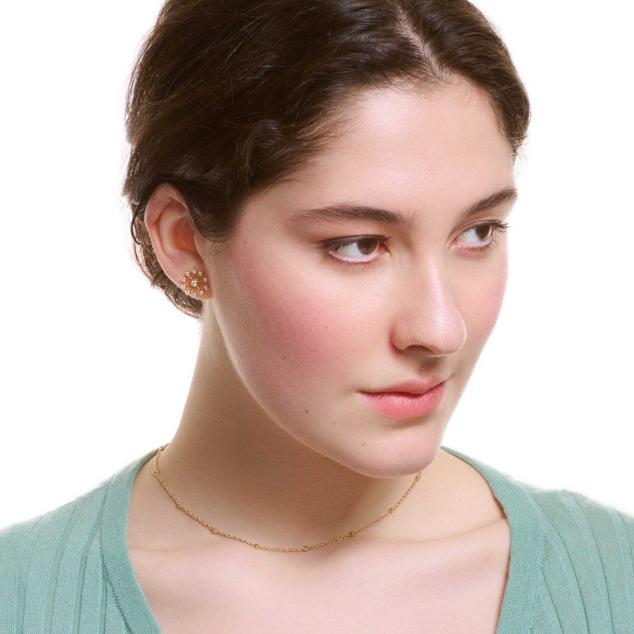 Model wearing a handcrafted yellow gold necklace chain with small gold beads.