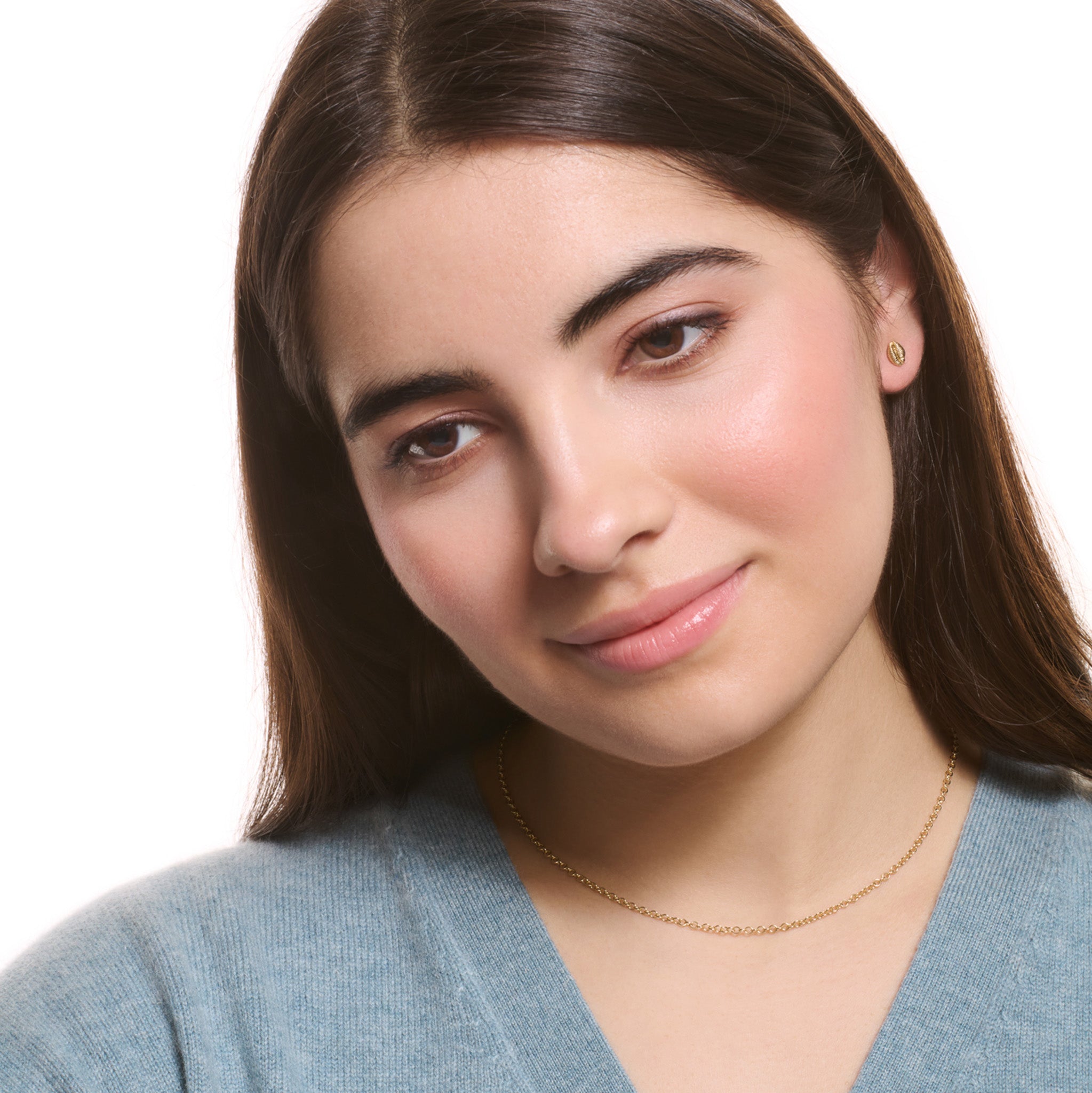 Model wearing a handcrafted yellow gold necklace chain featuring small circular links.