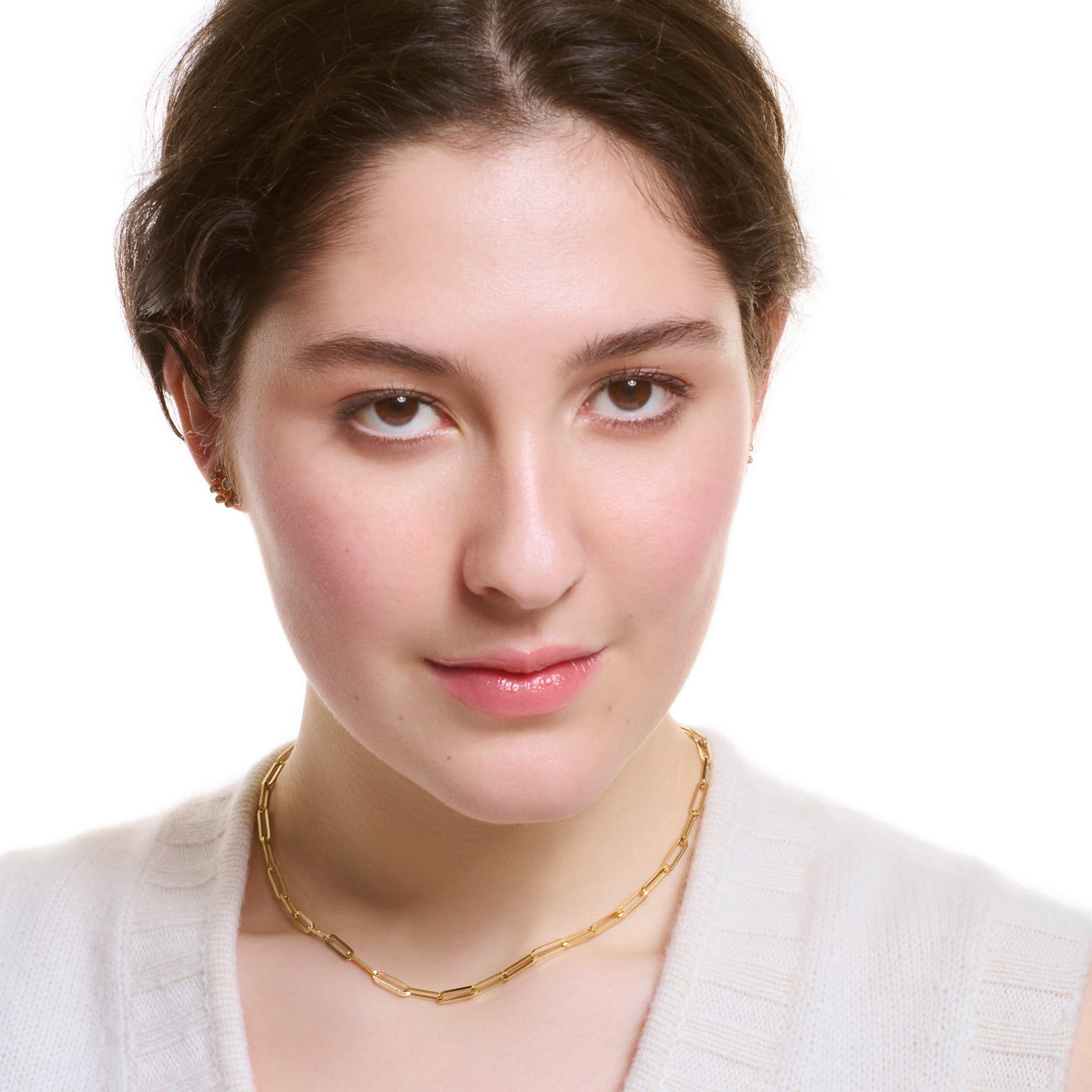 Model wearing a handcrafted yellow gold necklace chain featuring long oval links.