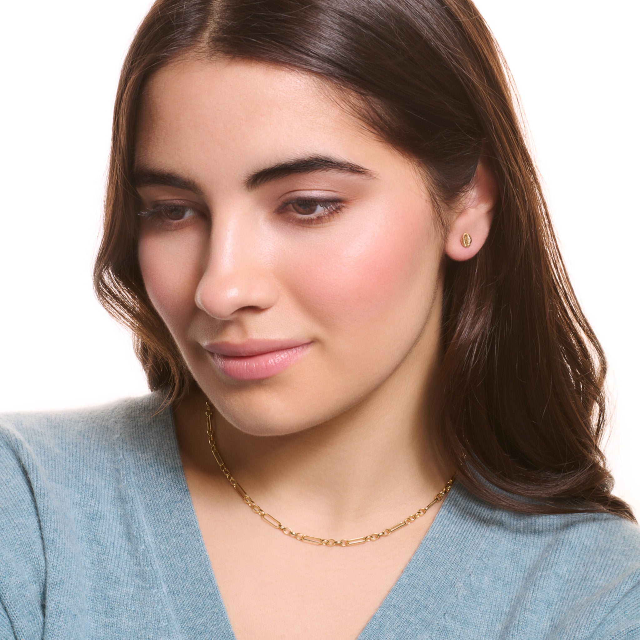 Model wearing a handcrafted yellow gold necklace chain featuring oval and rectangular links.