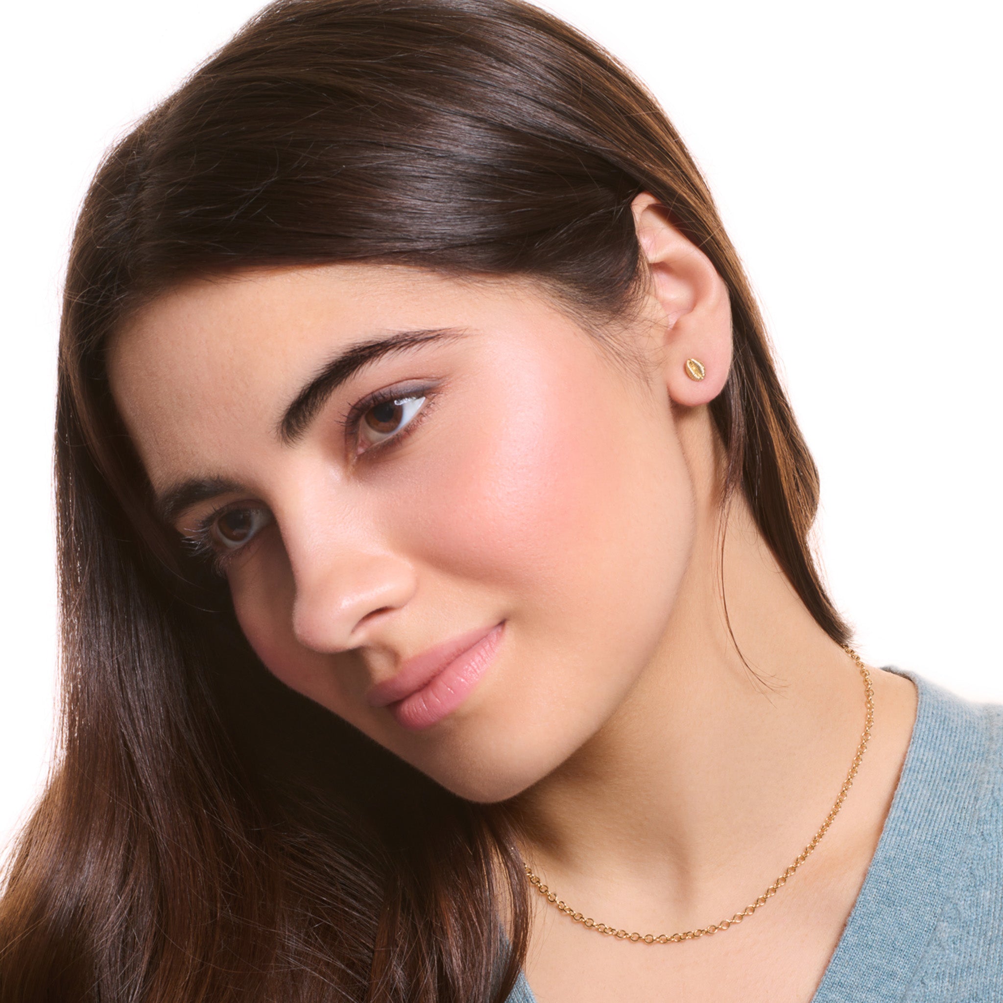 Model wearing a handcrafted yellow gold necklace chain featuring small circular links.