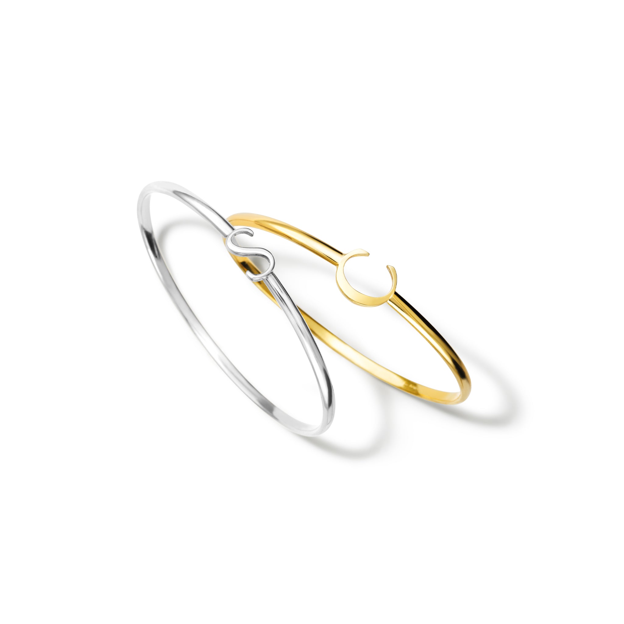 Handcrafted yellow gold bangle with a central yellow gold letter accent.