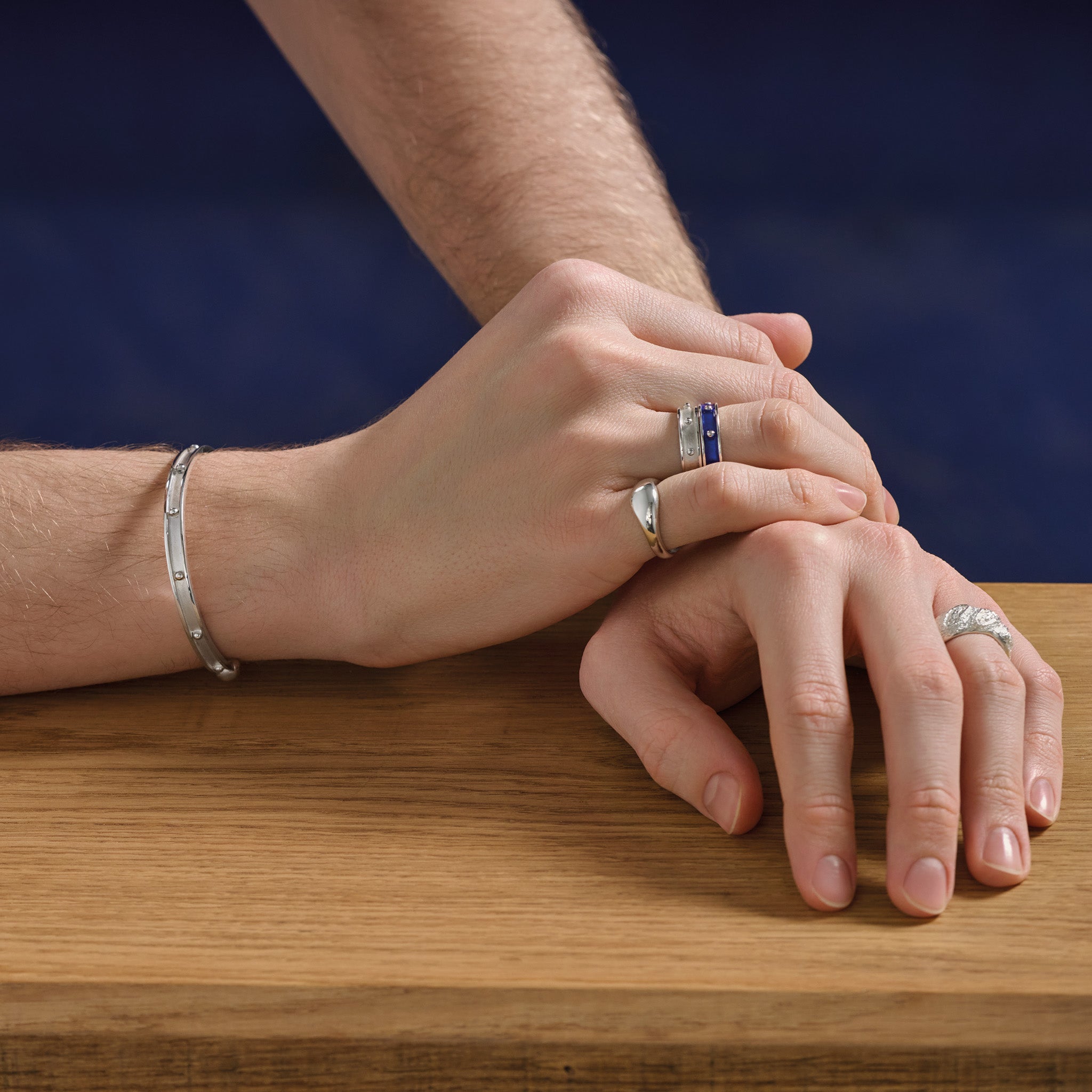 Model wearing a handcrafted sterling silver bracelet cuff and ring with evenly spaced, protruding round dots.